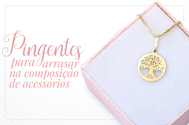 Pingente de ouro da árvore da vida em uma caixinha rosa, ao lado está escrito: pingentes para arrasar na composição de acessórios