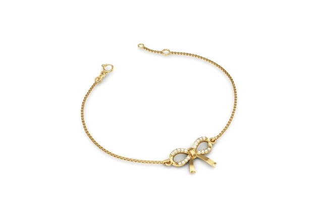 Pulseira de ouro com pingente de laço com pedras brancas